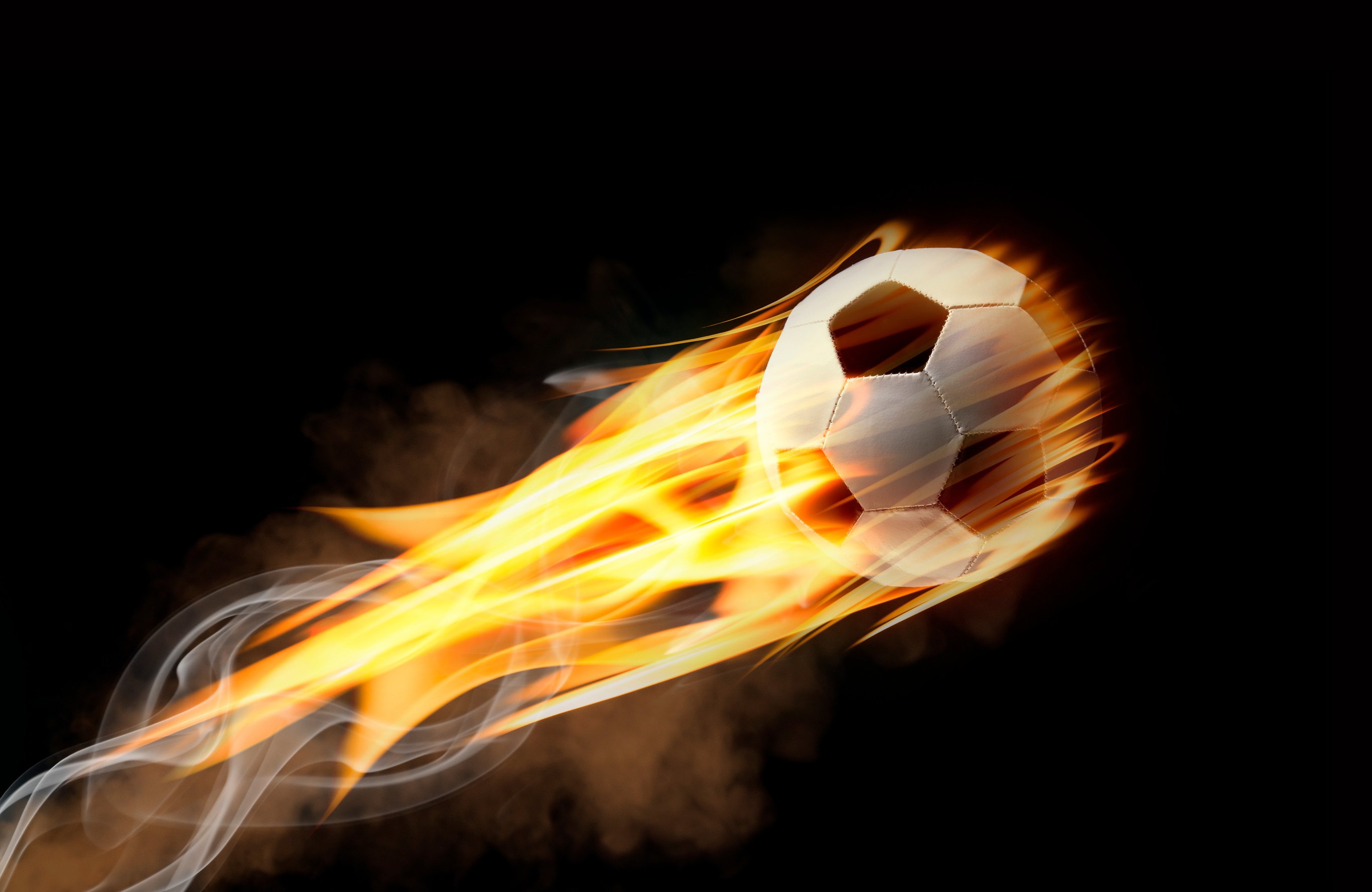 Flying football or soccer ball on fire